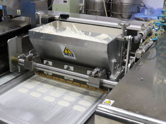 Dacquoise being produced with a Stencil Cookie Machine
