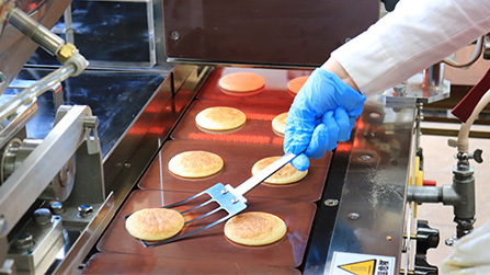A custom-made spatula ensures a smooth, wrinkle-free finish.
